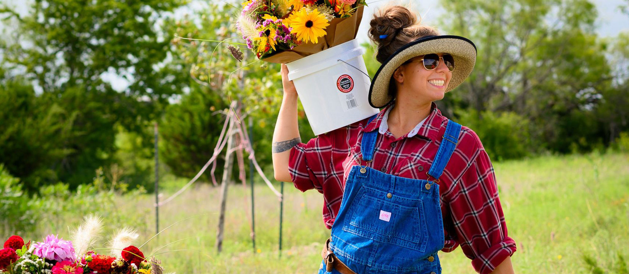 Woman holding a bucket happy.